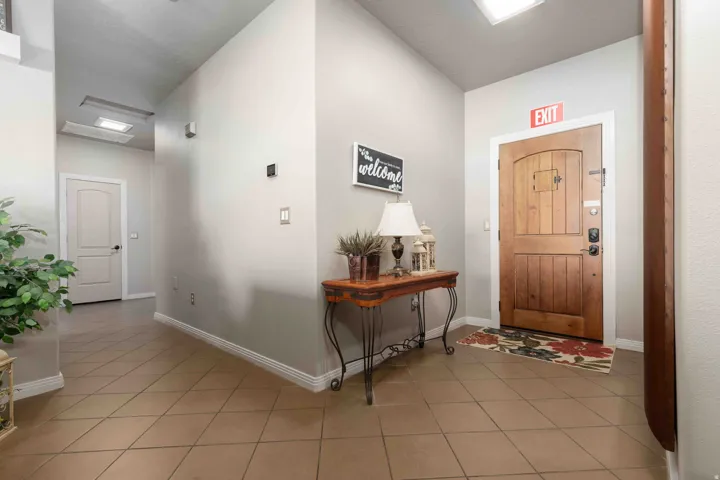 Foyer featuring light tile patterned floors