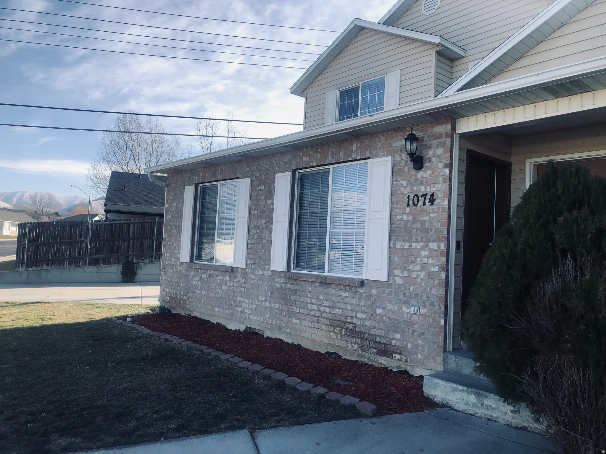 View of side of home featuring brick siding