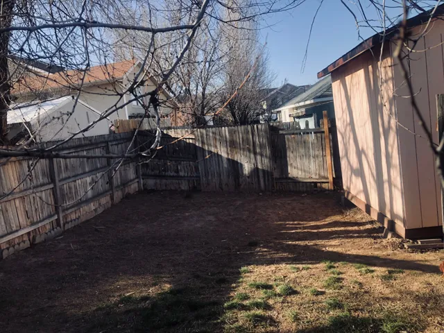 View of fenced backyard