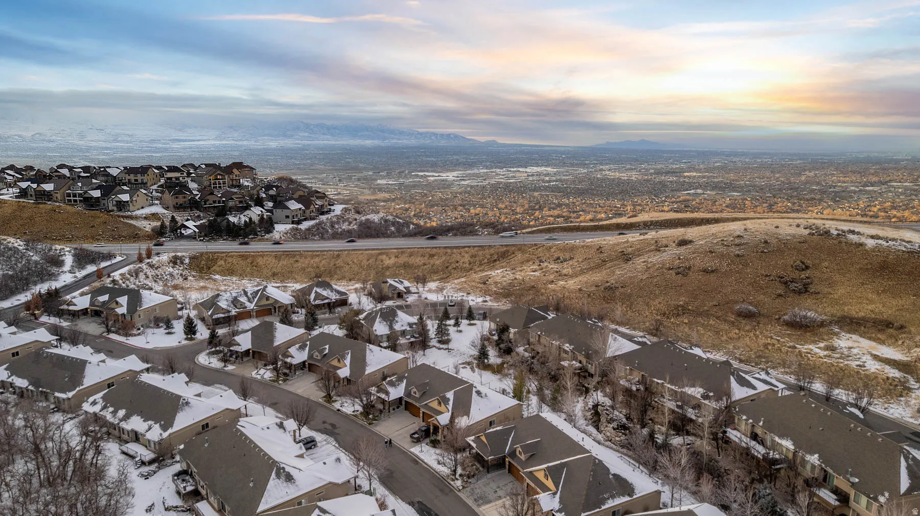 Aerial view at dusk of a residential view and a mountain view