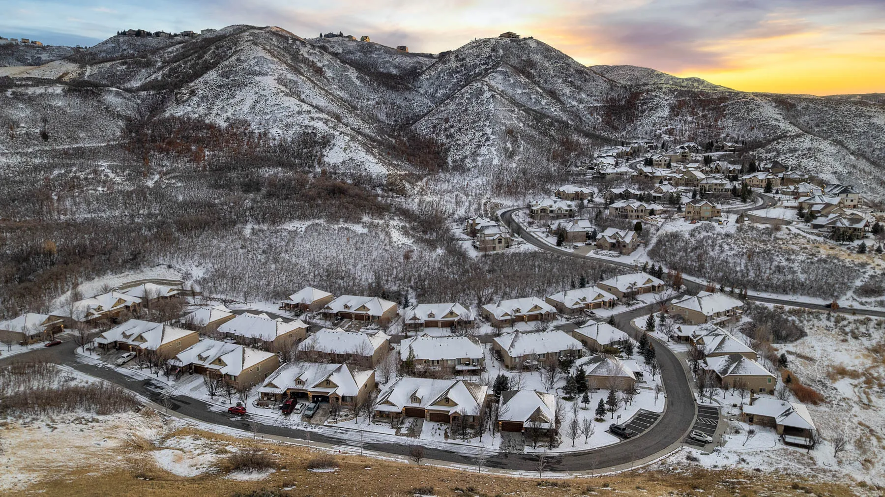 Snowy aerial view featuring a mountain view