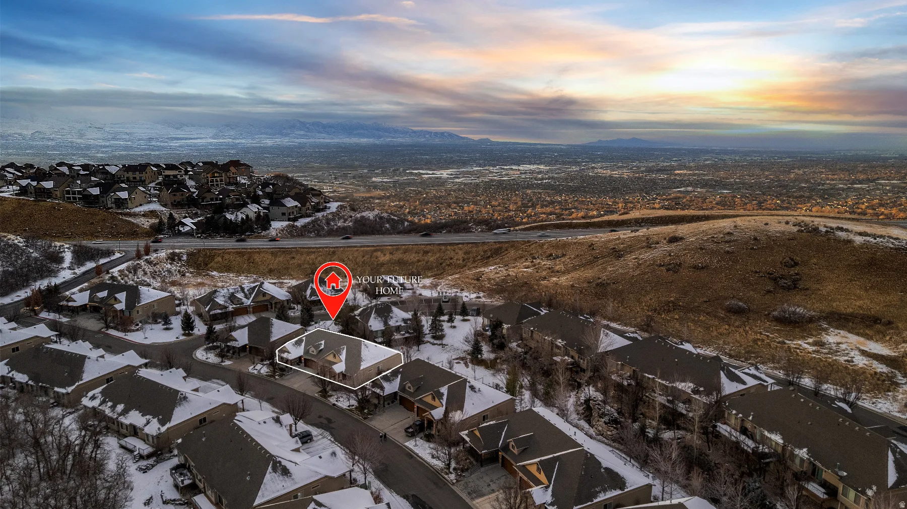 Snowy aerial view featuring a residential view and a mountain view