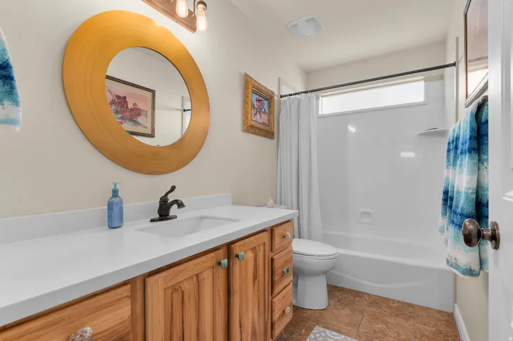 Full bathroom with vanity and shower / bath combo