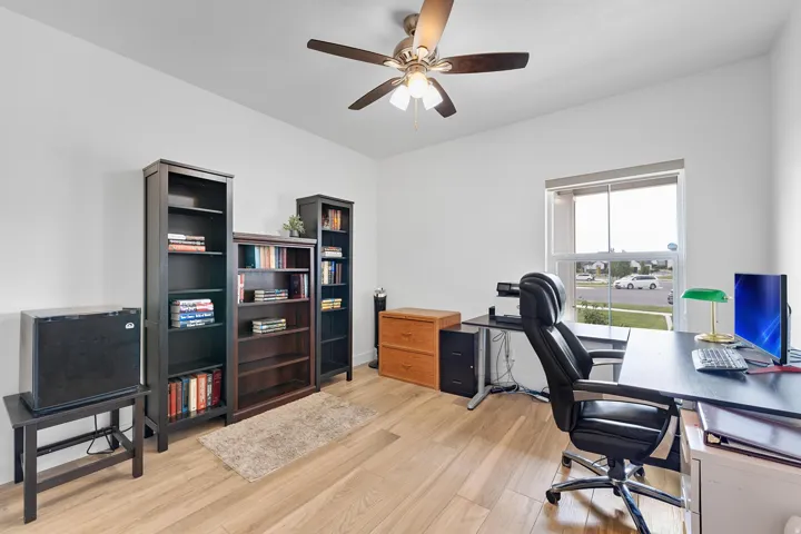 Office area featuring light wood-type flooring and ceiling fan
