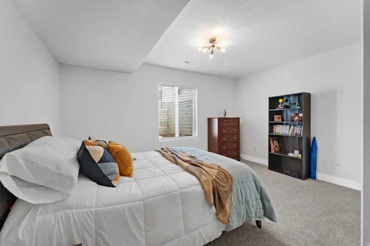 Carpeted bedroom with baseboards