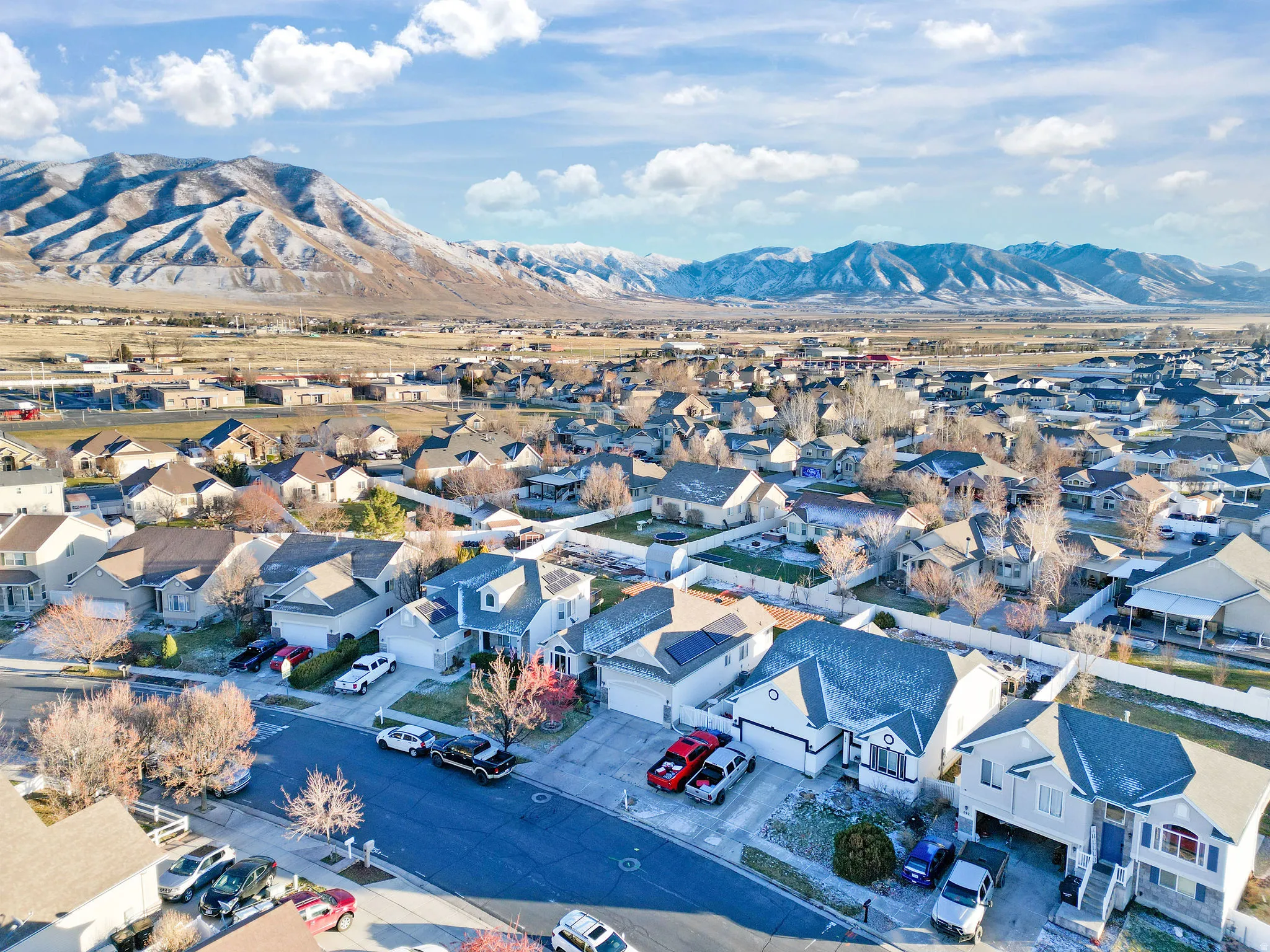 Aerial view of residential area featuring a mountainous background