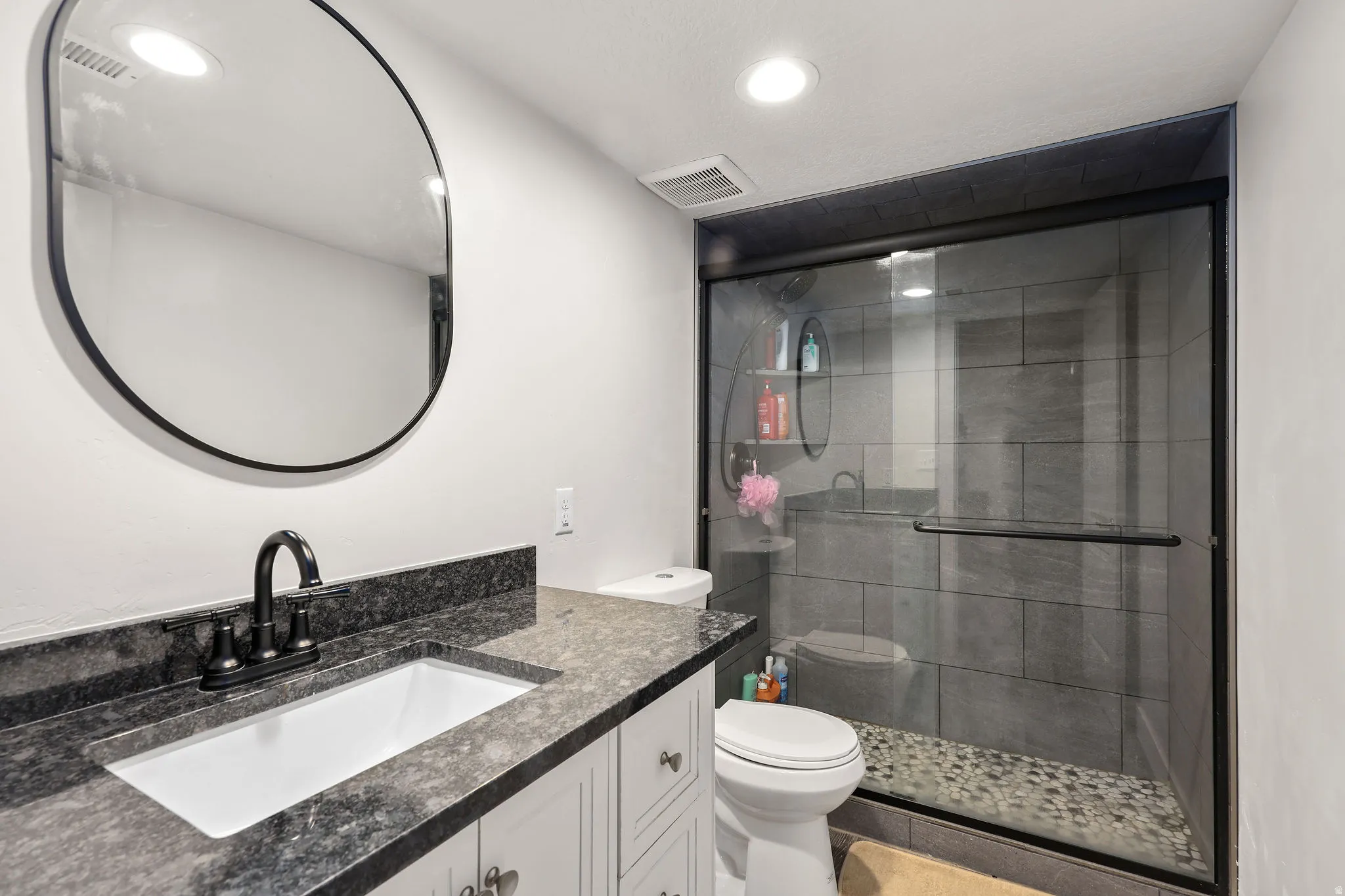 Full bathroom with vanity, a shower stall, recessed lighting, and tile patterned floors