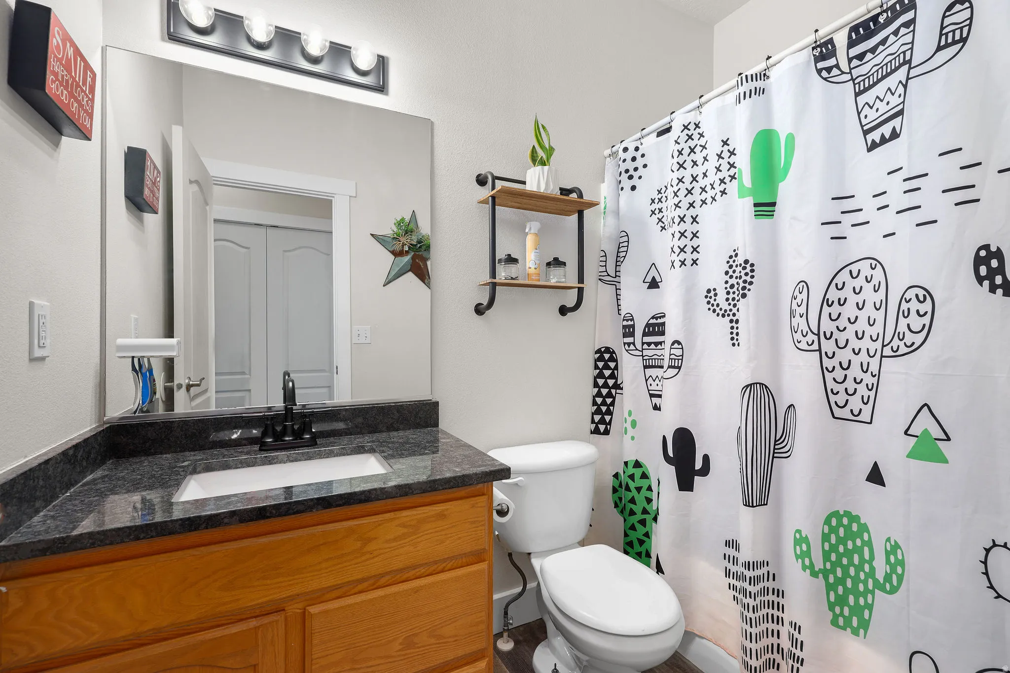 Full bathroom with a shower with shower curtain and vanity