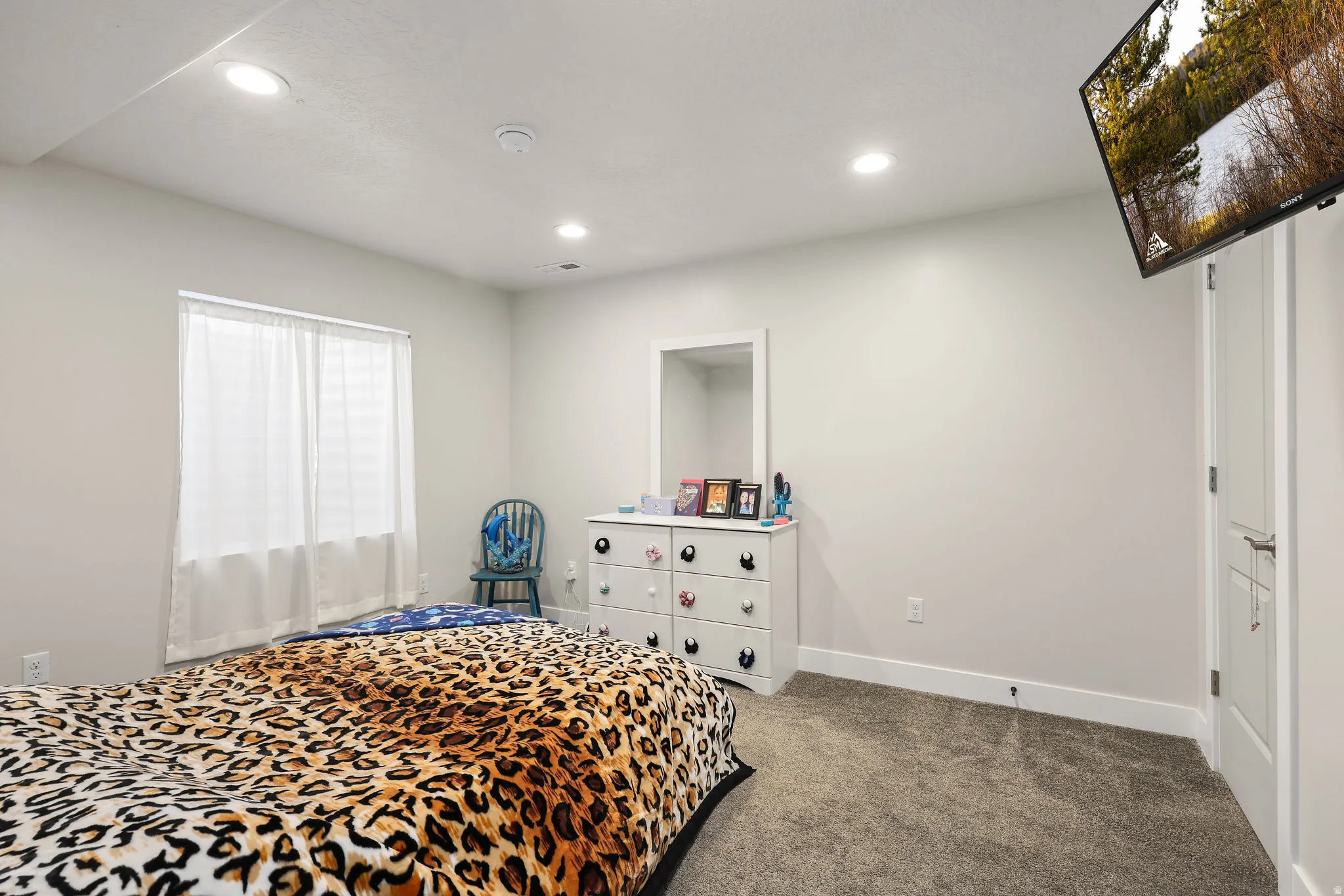 Carpeted bedroom featuring recessed lighting