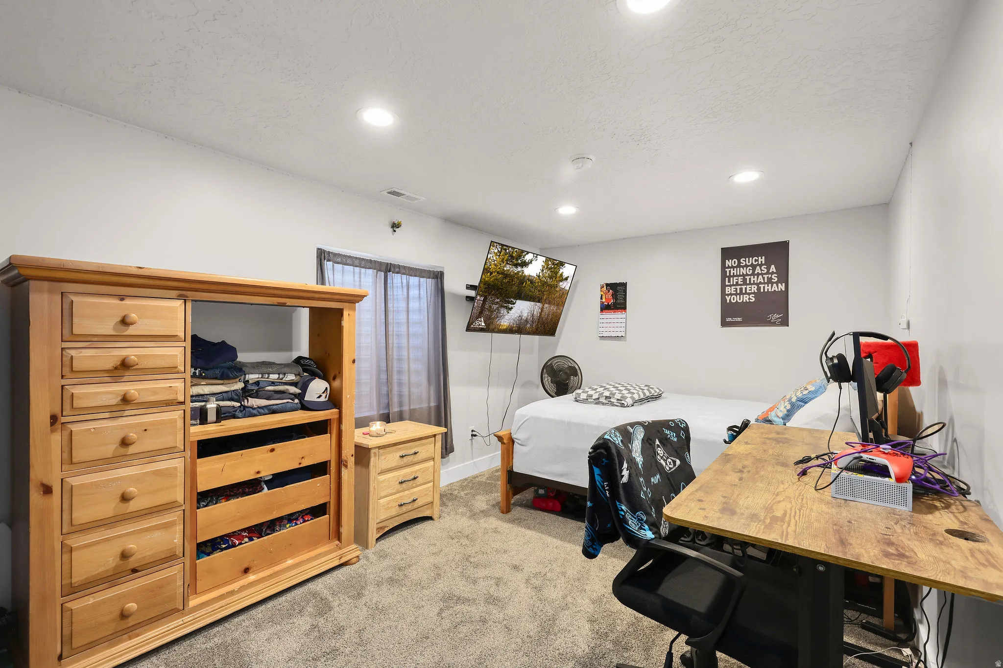 Office featuring light colored carpet, a textured ceiling, and recessed lighting