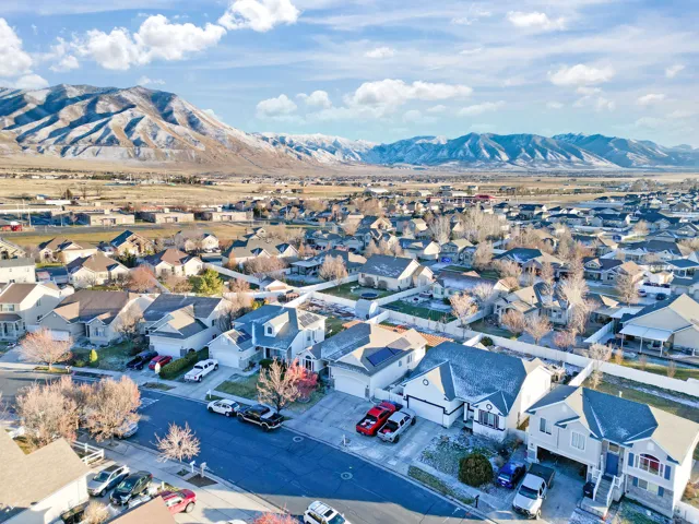 Aerial view of residential area featuring a mountainous background