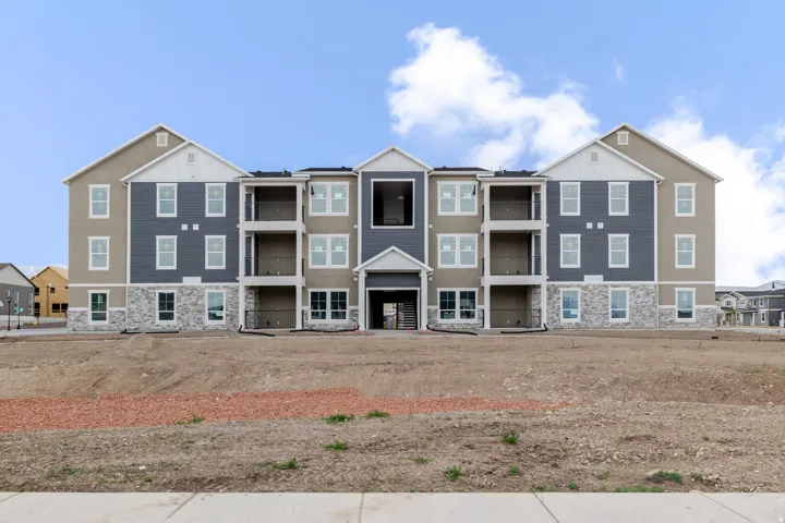 View of front of house with stone siding