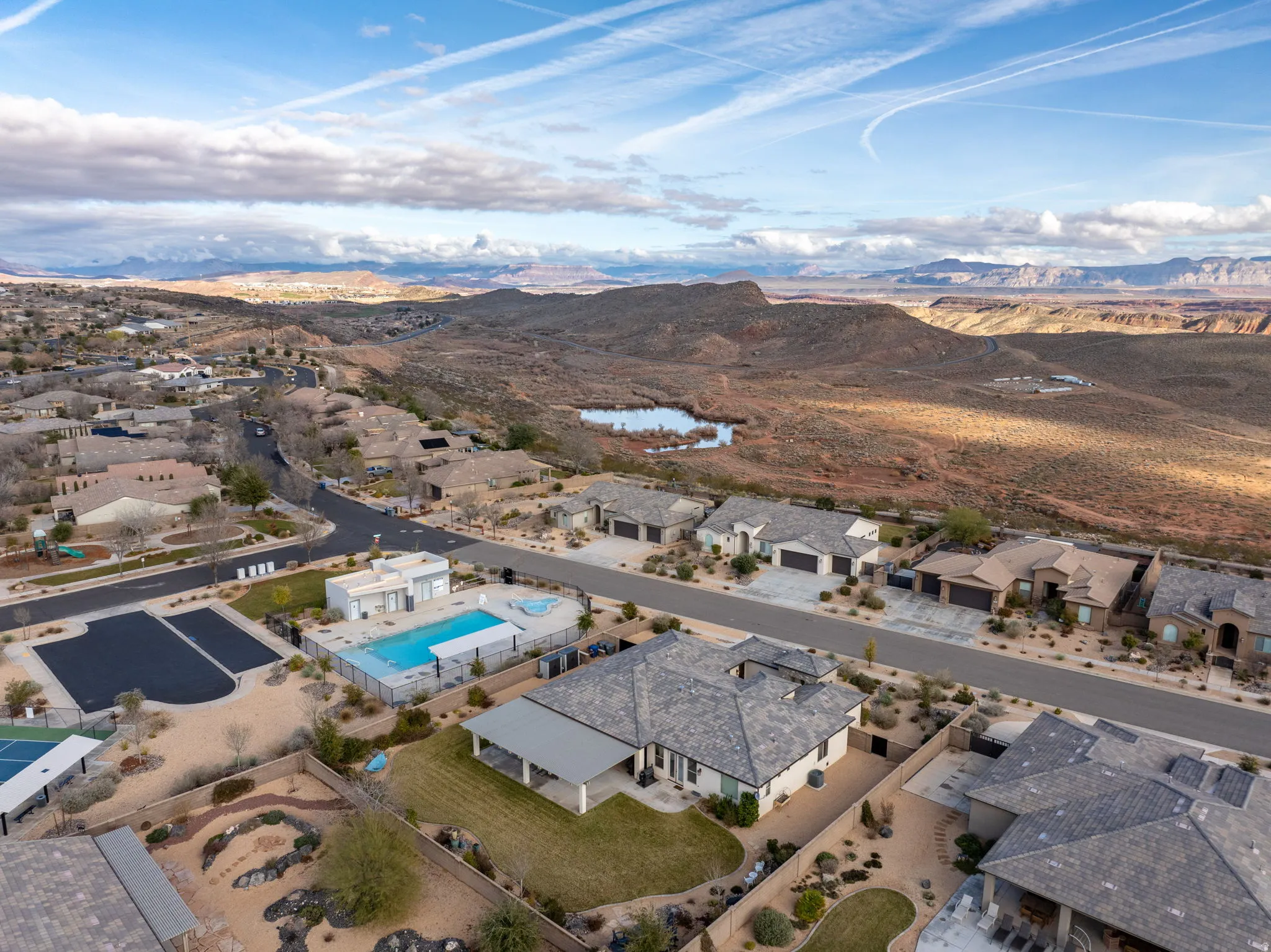 Aerial overview of property's location with mountains and nearby suburban area