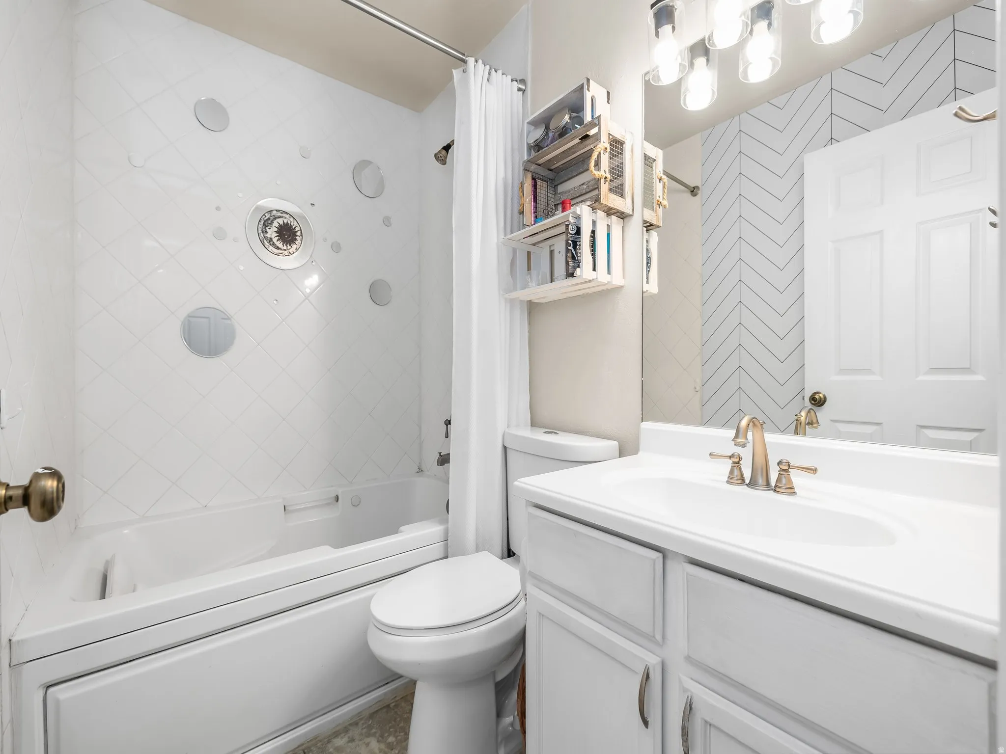 Full bathroom with shower / tub combo and vanity