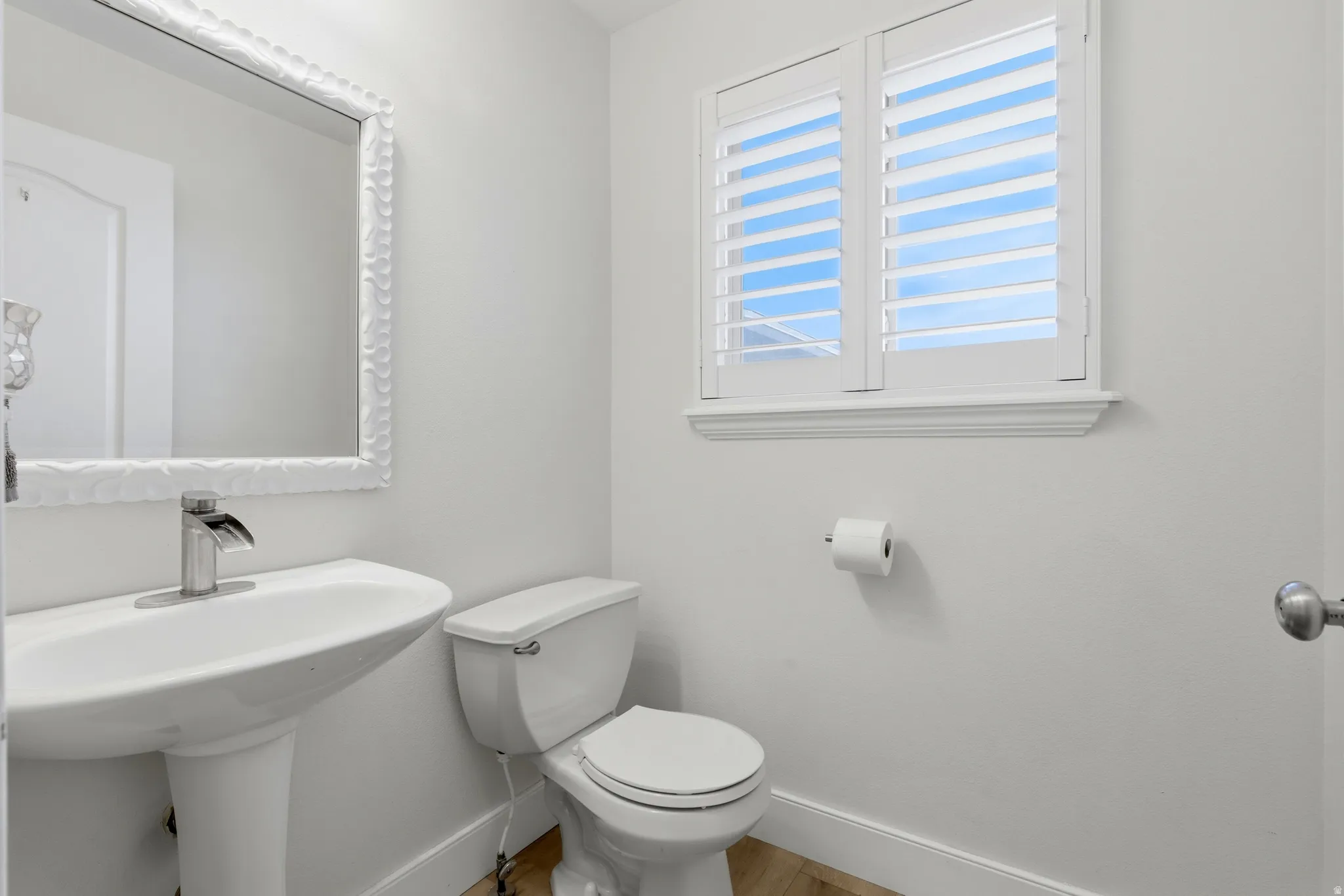 Half bathroom featuring baseboards