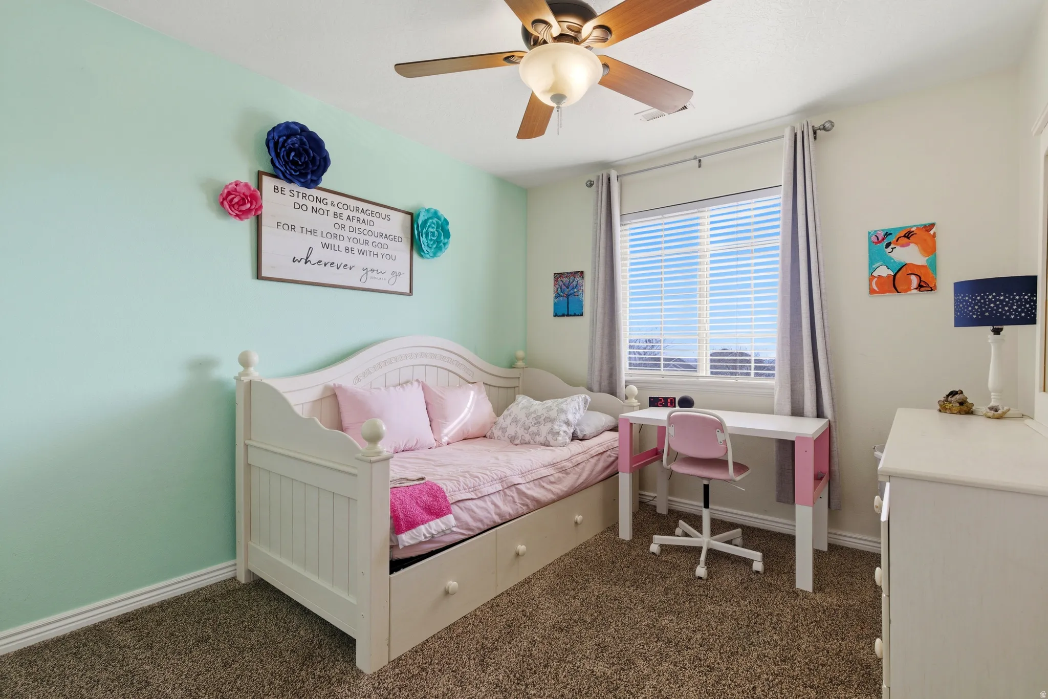 Bedroom with dark carpet and ceiling fan