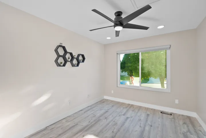 Office or Flex room featuring a ceiling fan, light wood-type flooring, and recessed lighting