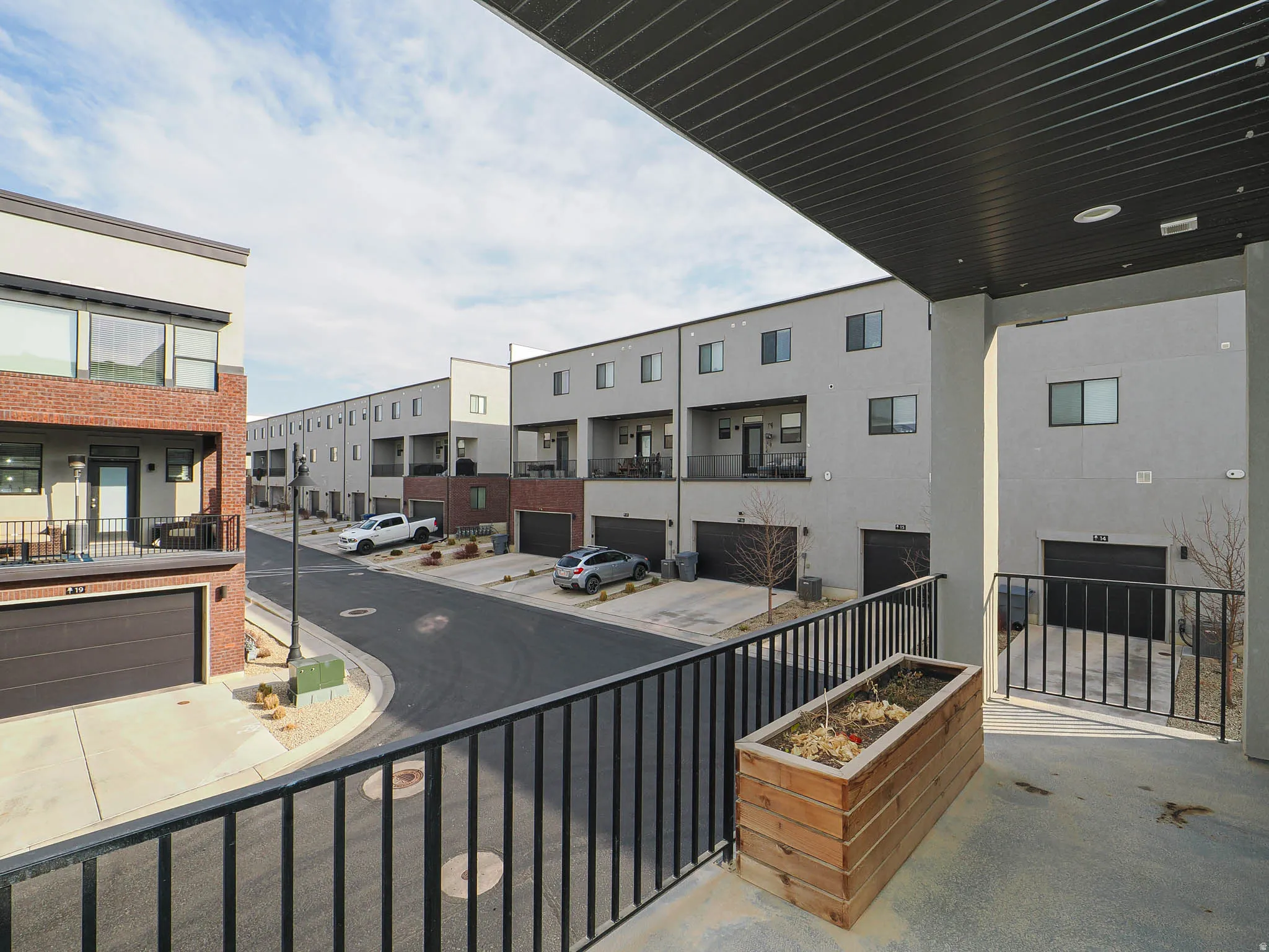 Level 2 balcony with seating and flower/garden box.