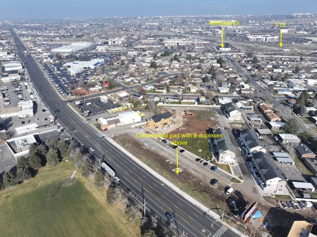 Aerial view of property's location with nearby urban area