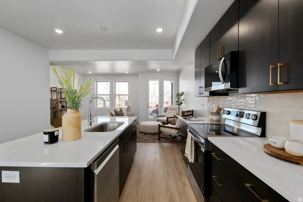 A total 'wow' kitchen-quartz countertops, stainless appliances, and a big island for charcuterie or homework.