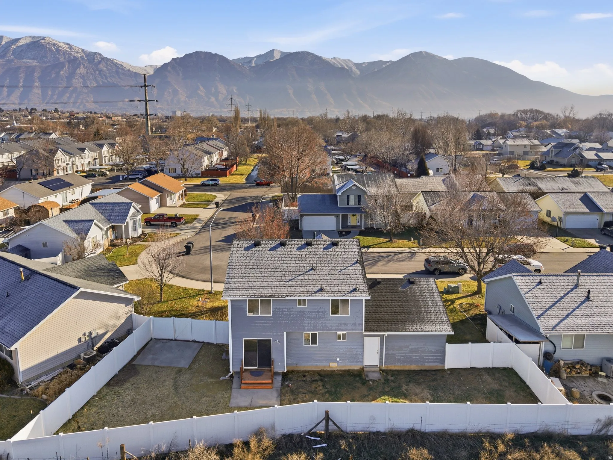 Aerial view of residential area with a mountainous background