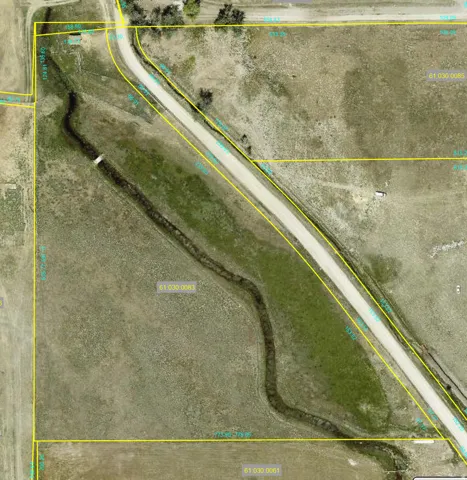 Aerial overview of property's location featuring property parcel outlined