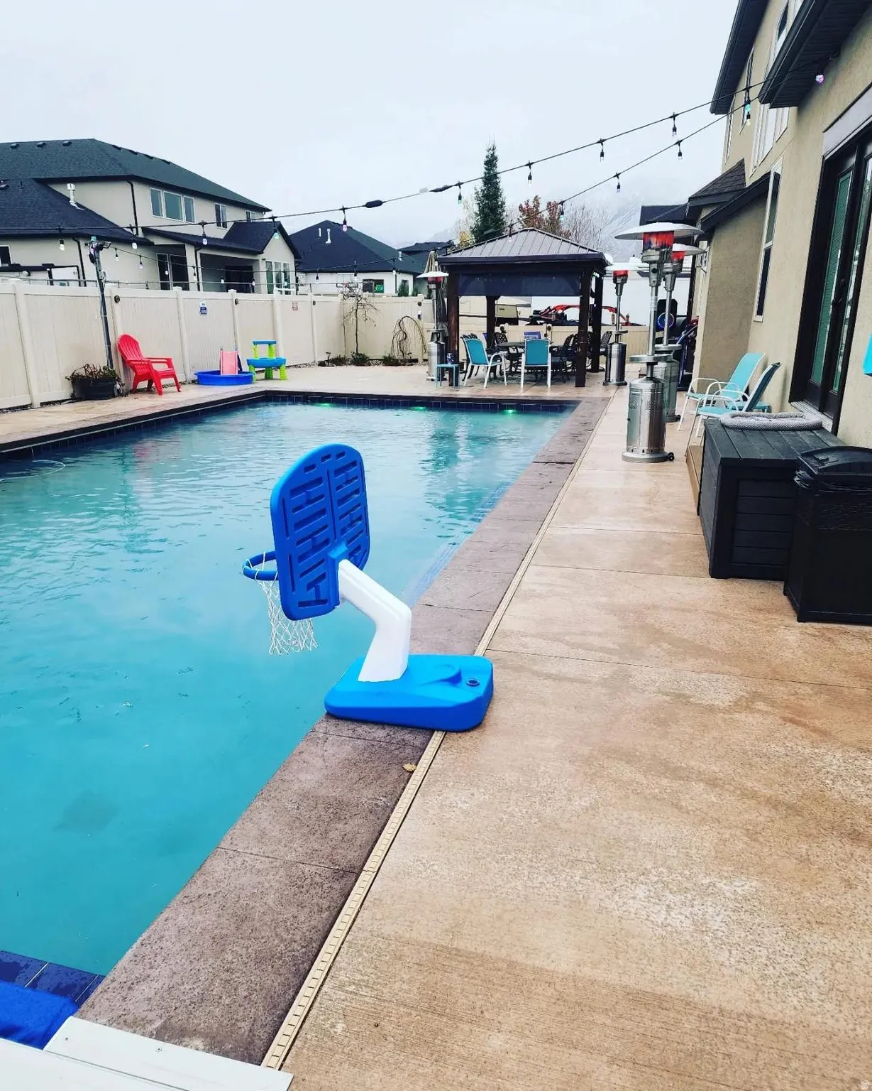 View of pool featuring a gazebo, a patio area, and a fenced backyard