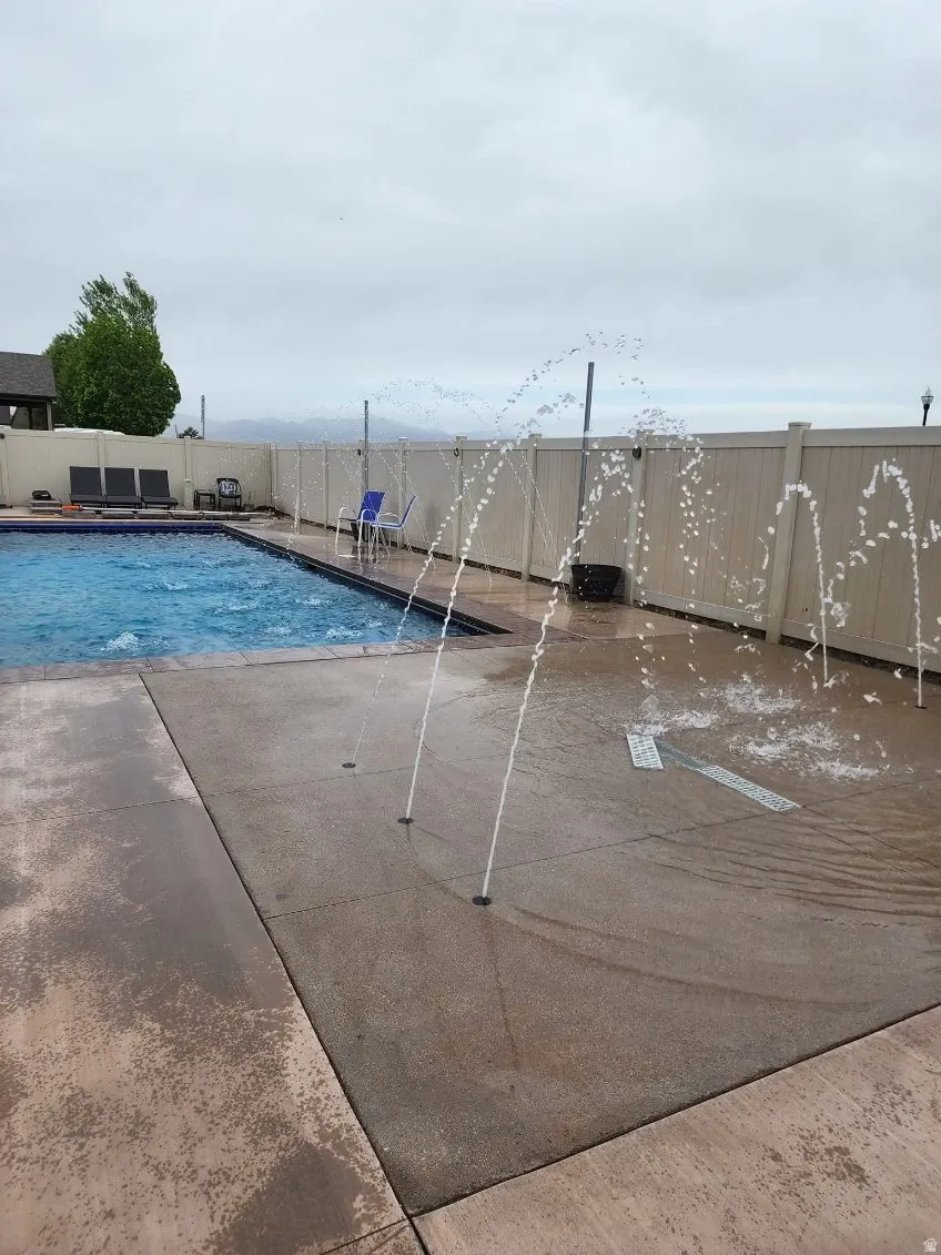 View of pool featuring a fenced backyard