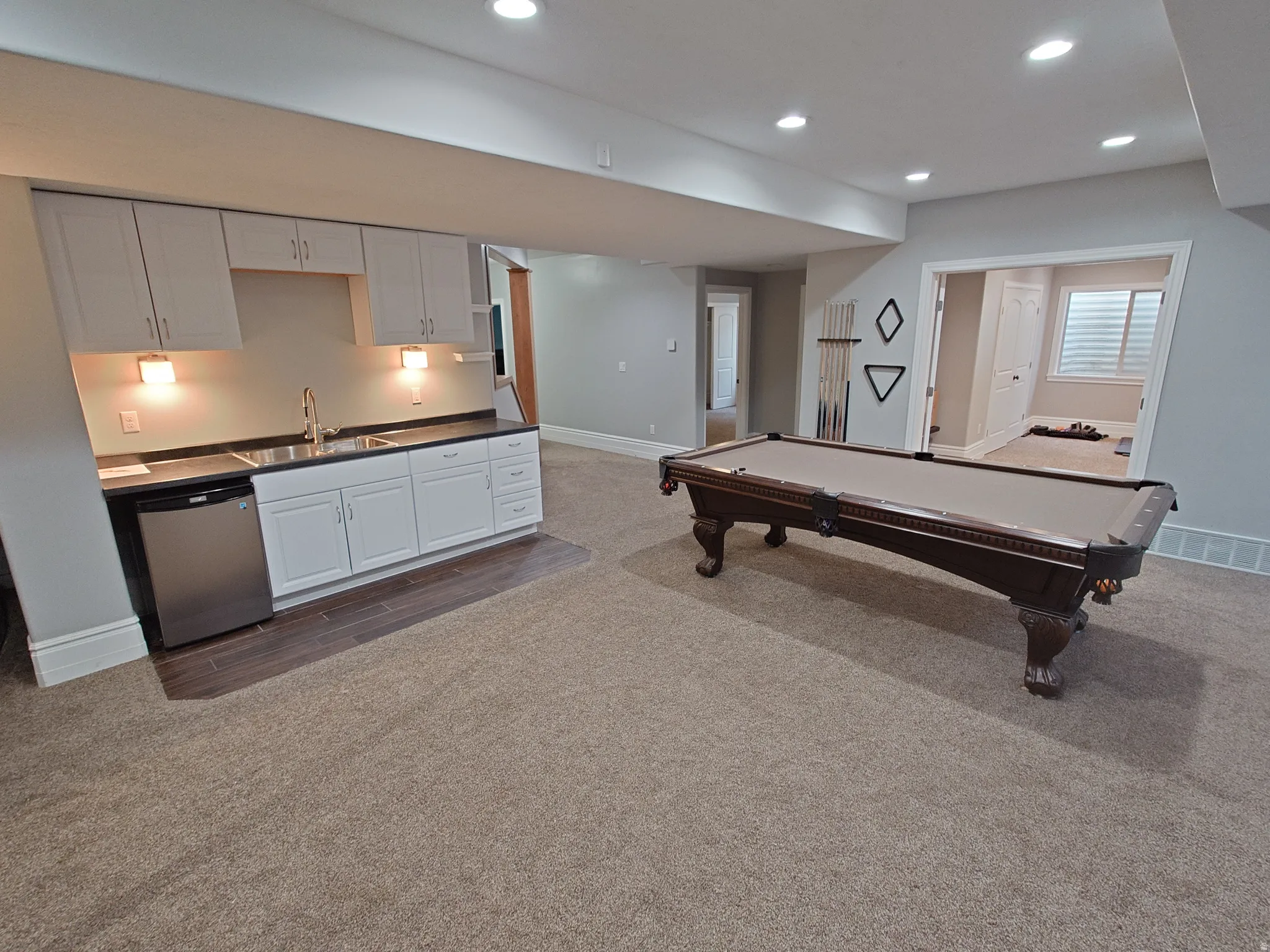 Recreation room featuring recessed lighting, dark colored carpet, and billiards table