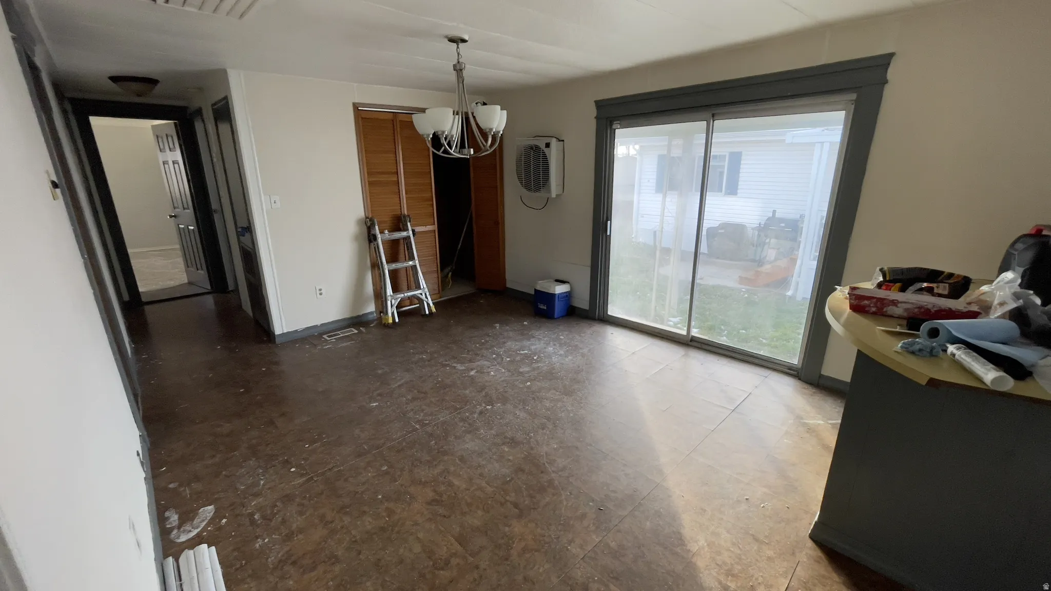 Dining space featuring a chandelier and baseboards