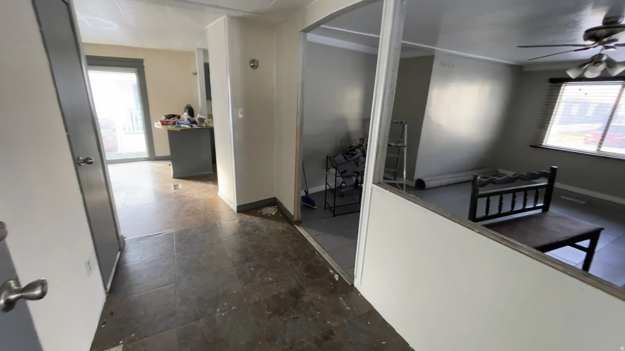 Hallway featuring arched walkways and baseboards