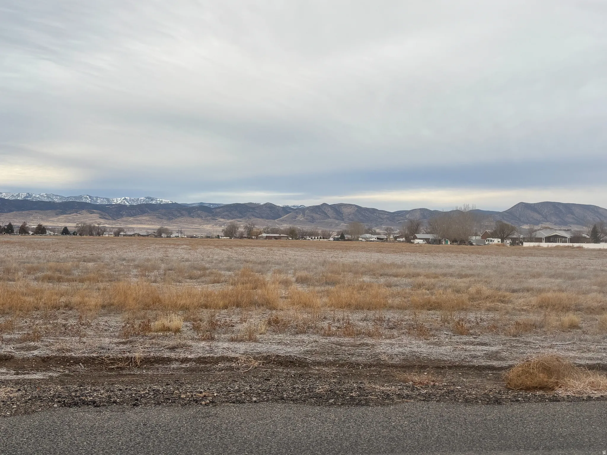 View of mountain backdrop featuring rural landscape