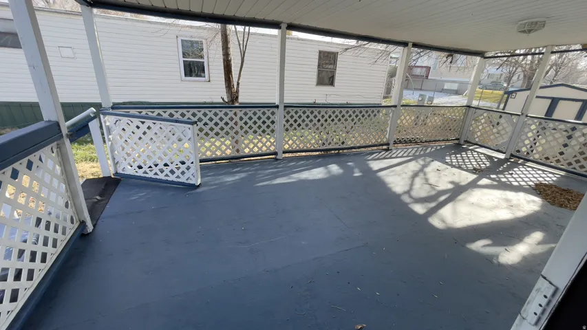 View of patio / terrace featuring a storage unit