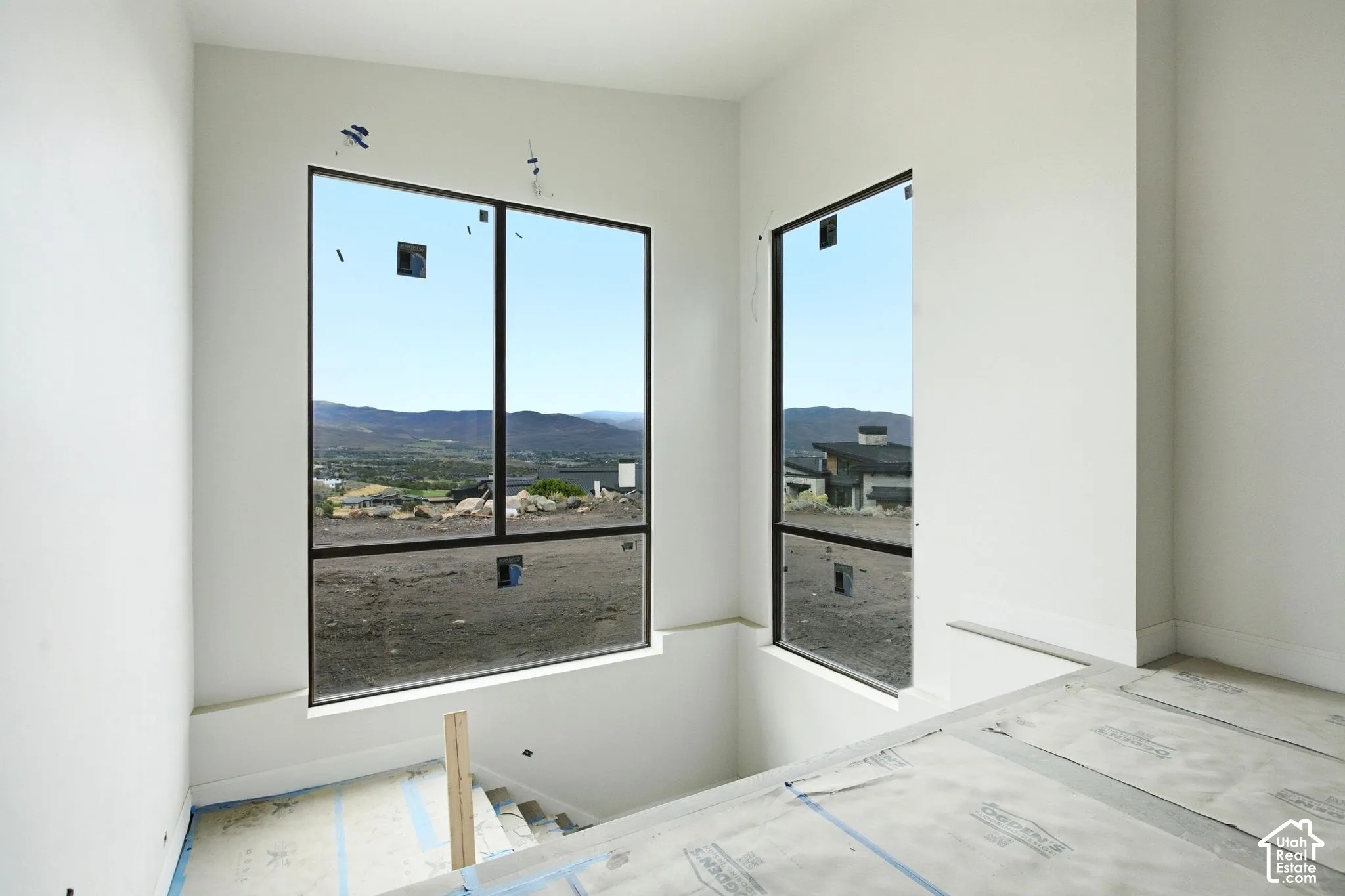 Expansive floor-to-ceiling windows with black frames