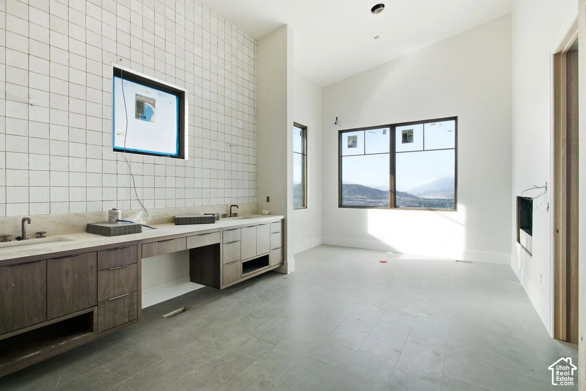 White tiled accent wall with integrated window