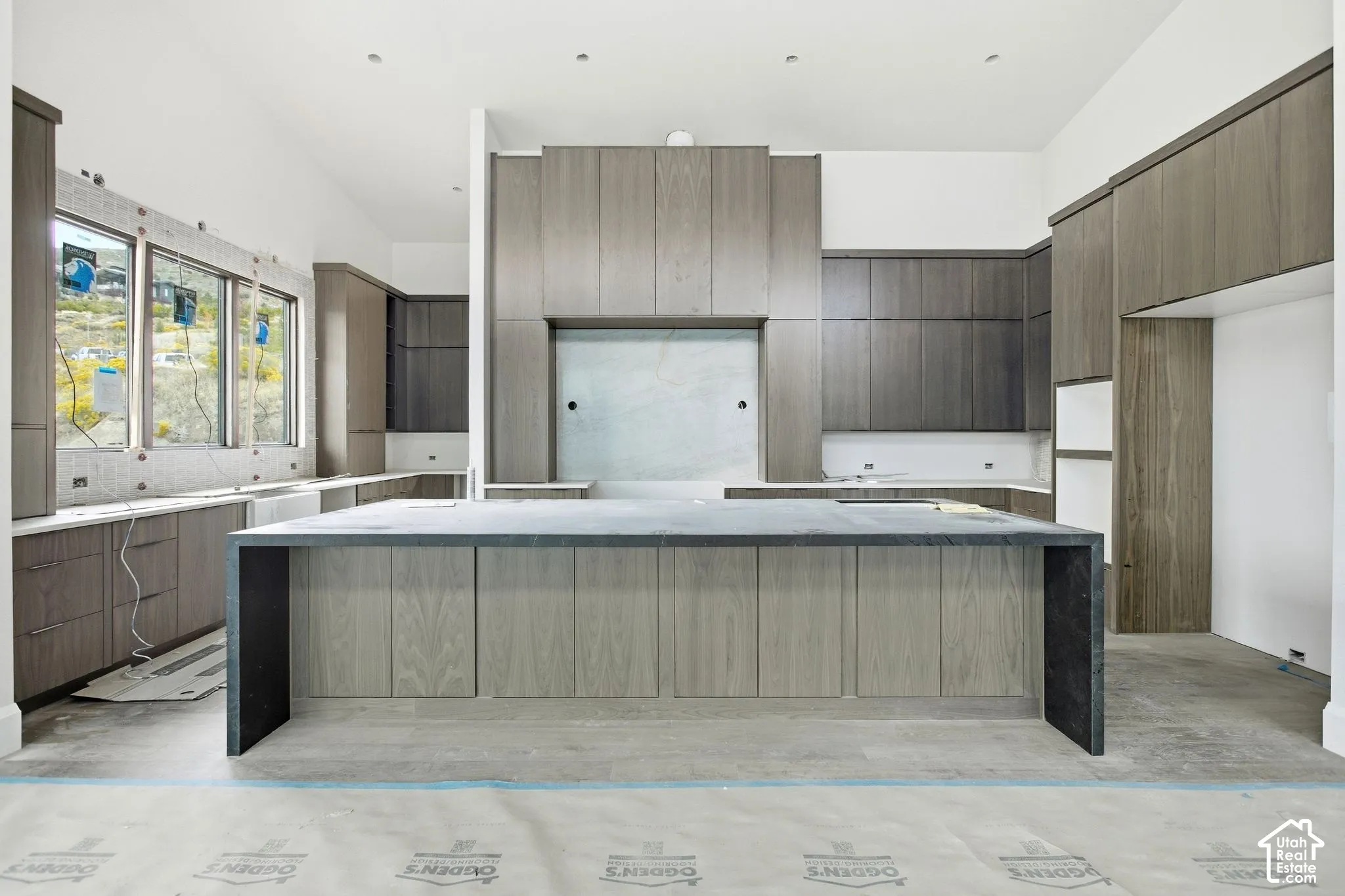 Large central island with a solid surface countertop