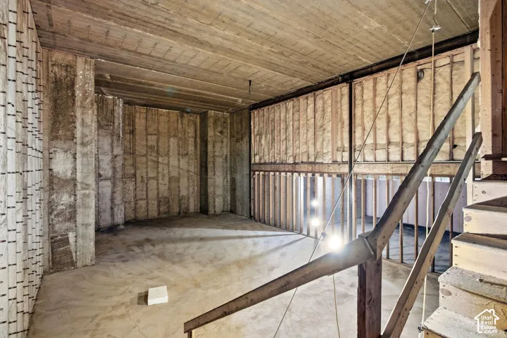 Unfinished lower level with UNLIMITED possibilities. With almost 2,000 sqft and over 20 foot ceilings anything is possible!