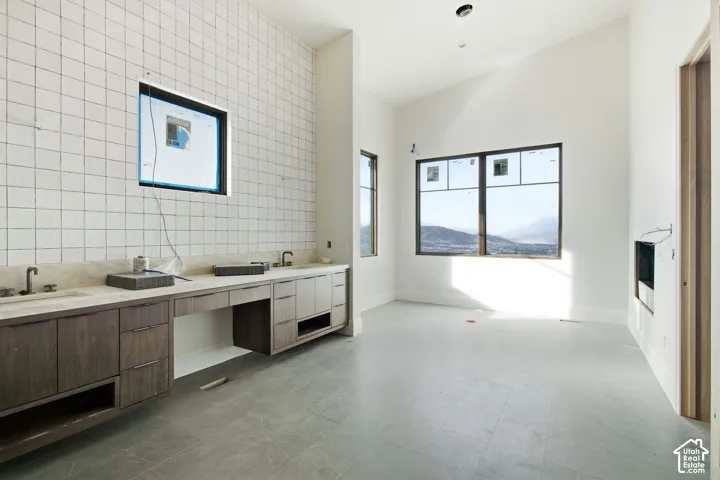 White tiled accent wall with integrated window