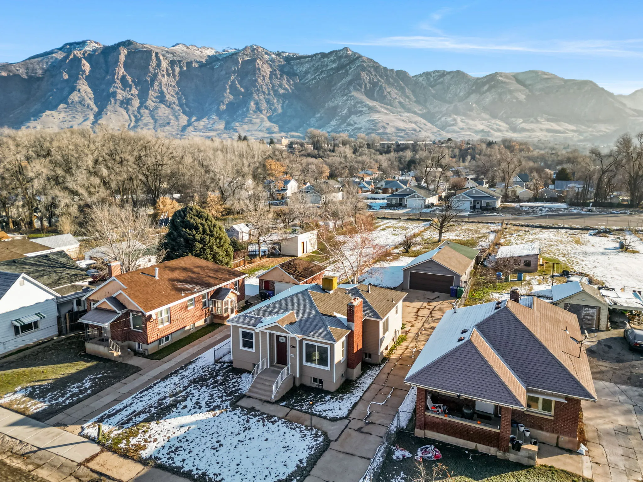 View of mountain backdrop featuring nearby suburban area