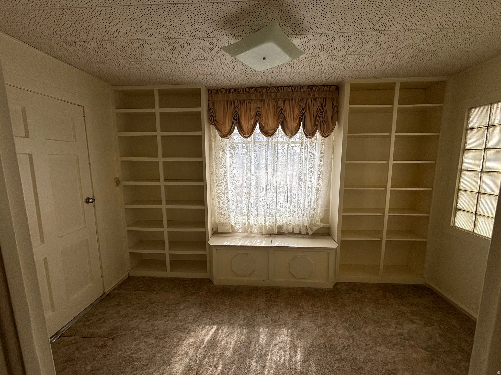 Unfurnished dining area with carpet