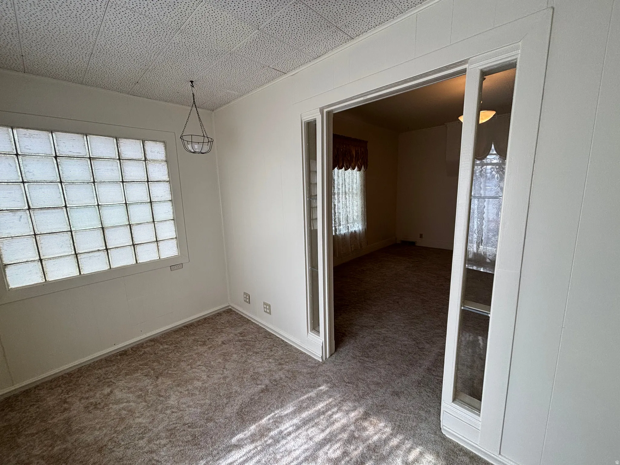 Spare room with carpet floors and baseboards