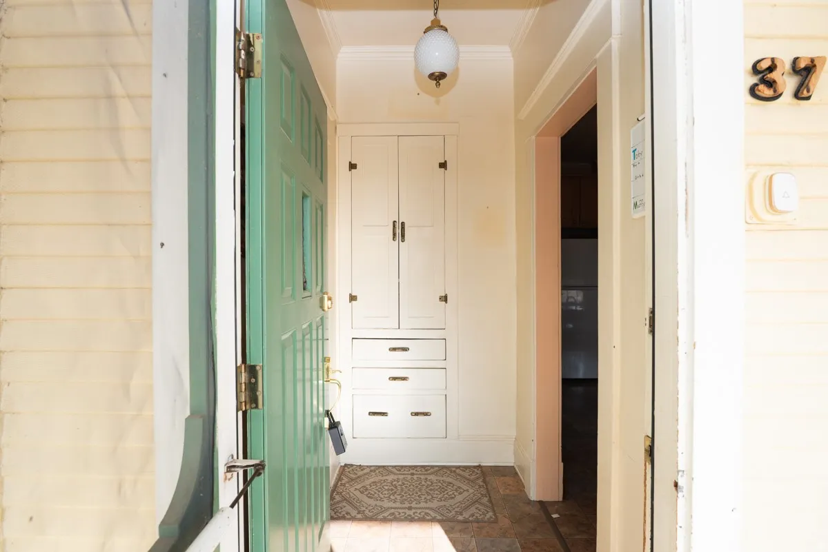 Bathroom with ornamental molding and baseboards