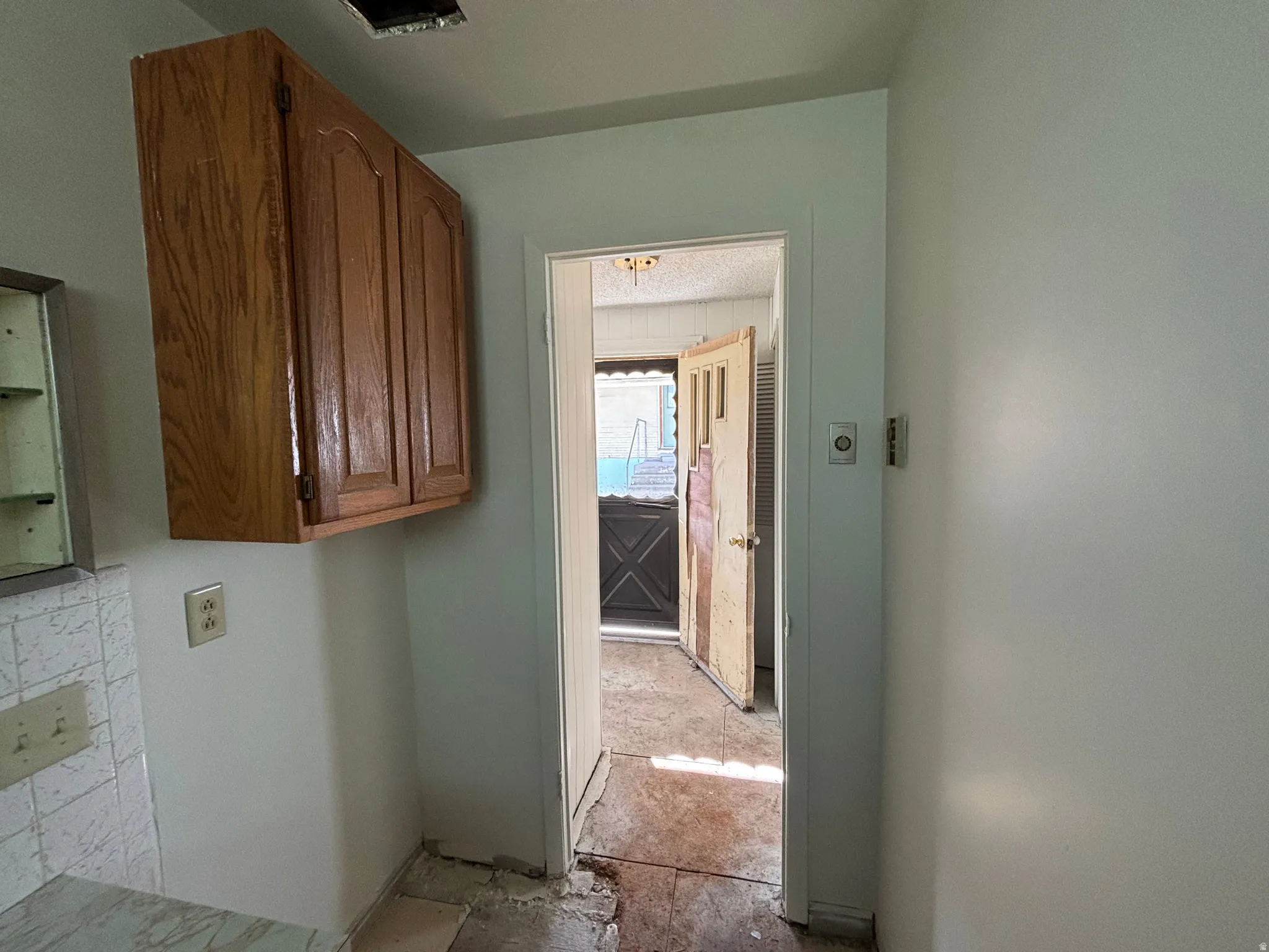 Laundry room featuring cabinet space