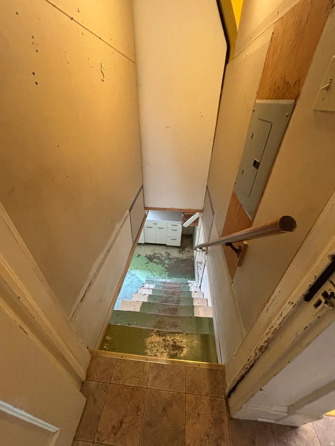 Staircase featuring electric panel