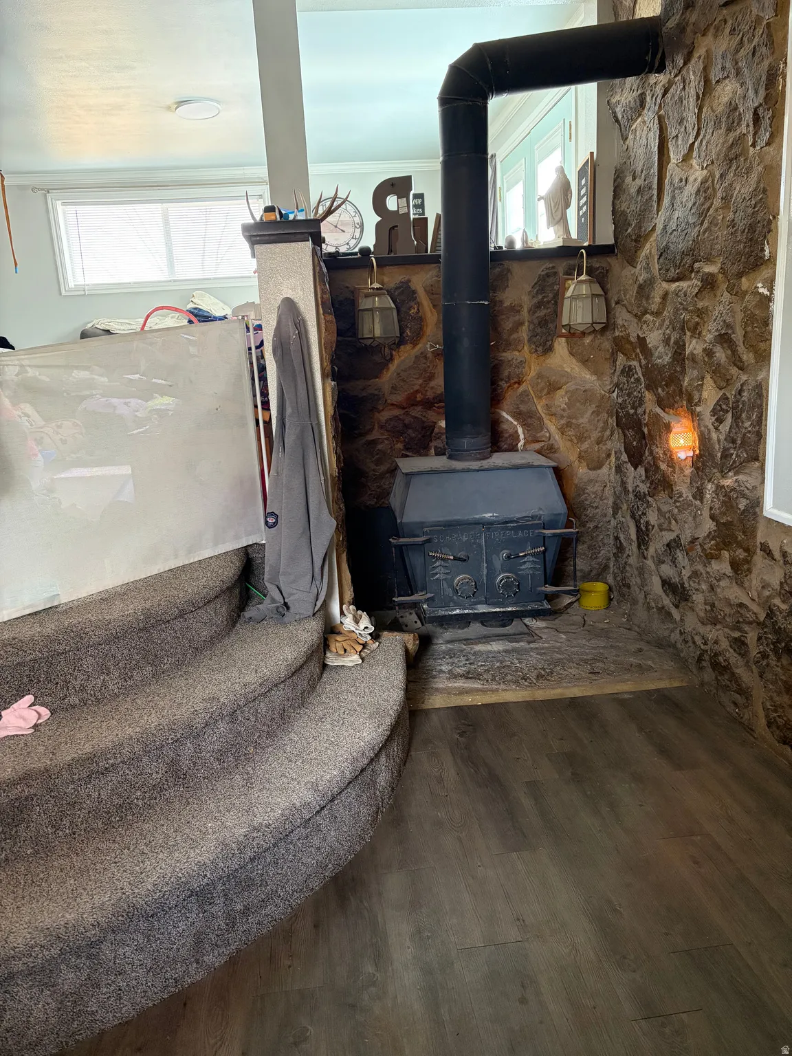 Detailed view of a wood stove and wood finished floors