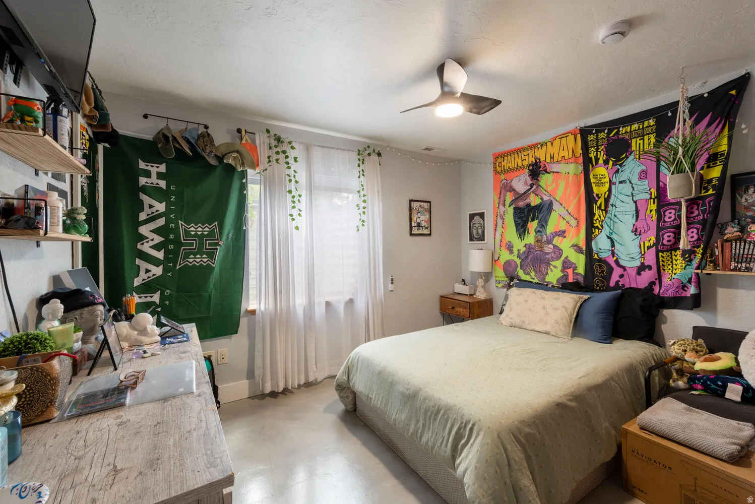 Bedroom featuring a ceiling fan and finished concrete flooring