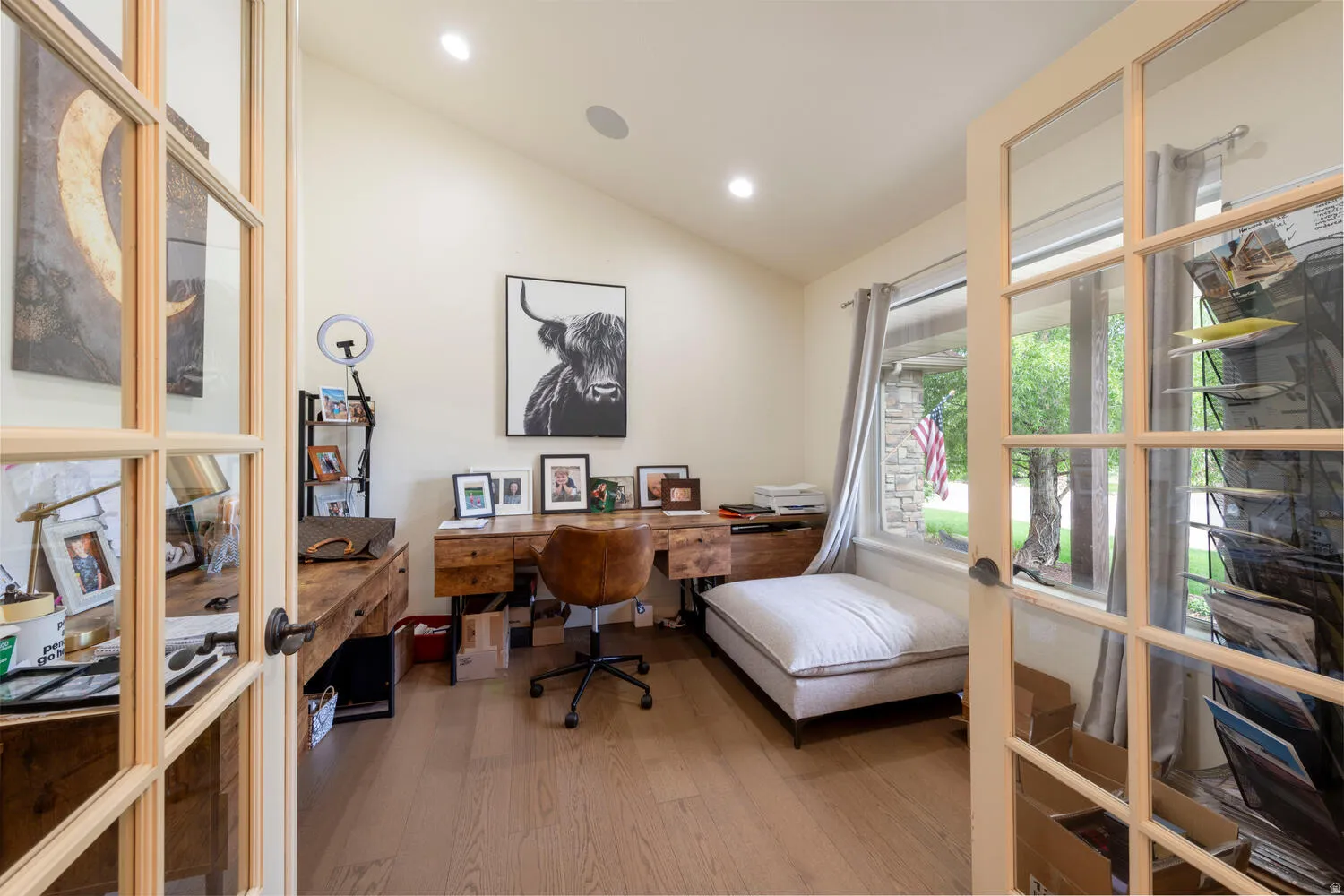 Office featuring vaulted ceiling, light wood-style floors, french doors, and recessed lighting