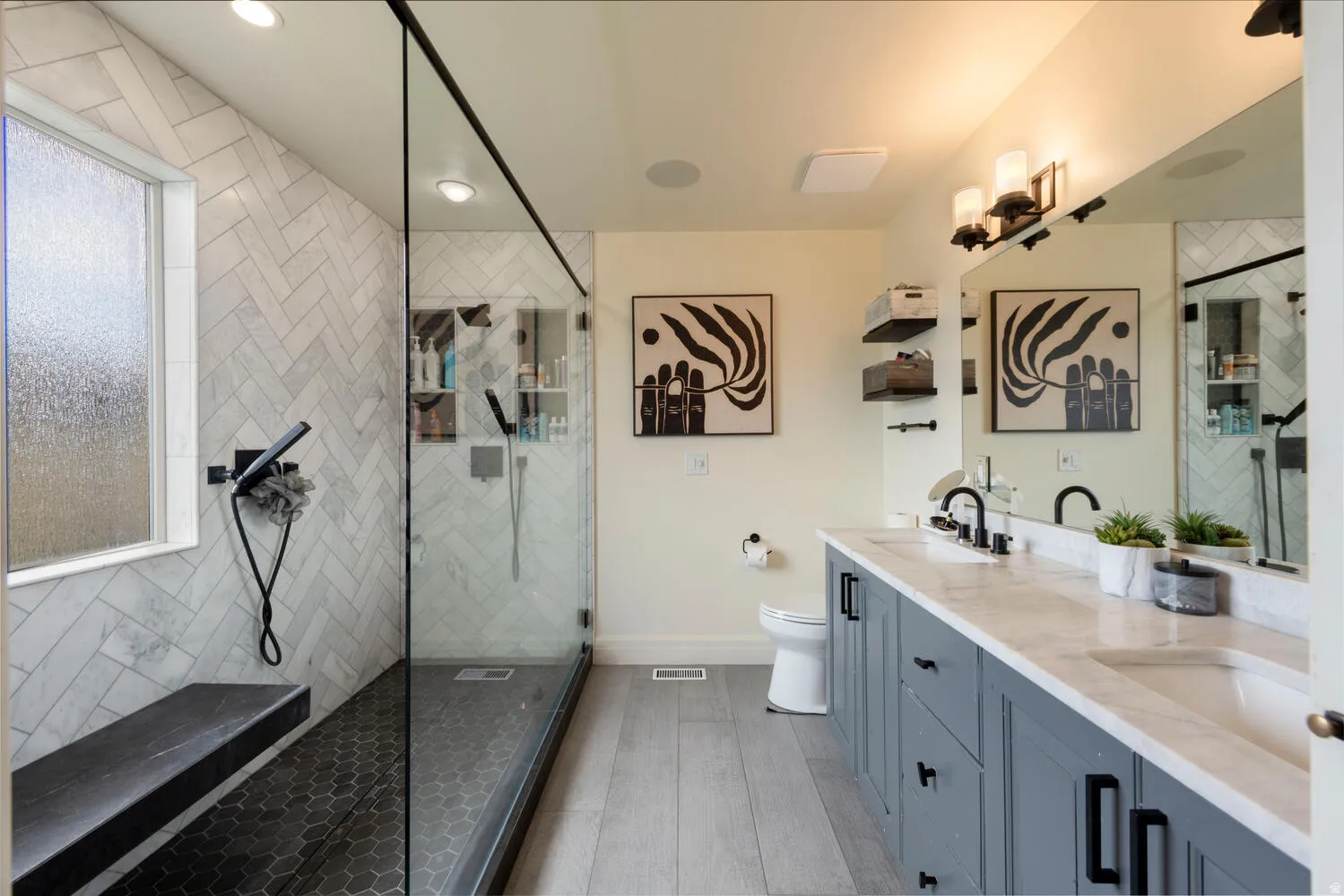 Bathroom with walk in shower, double vanity, light wood-style flooring, and recessed lighting