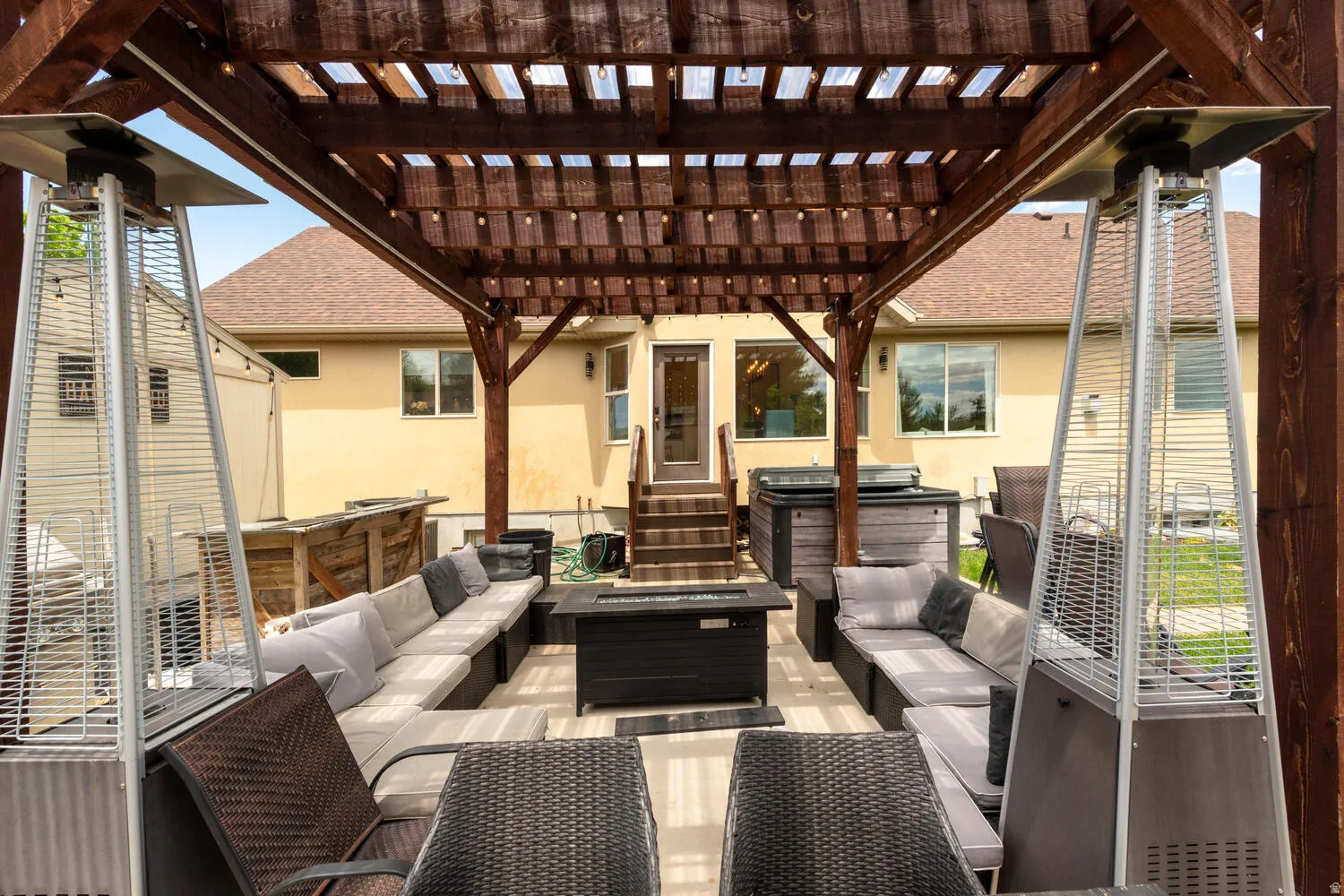 View of patio featuring outdoor lounge area and a pergola