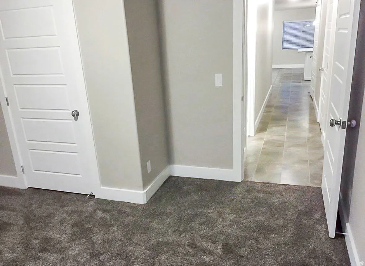 Hallway with light colored carpet
